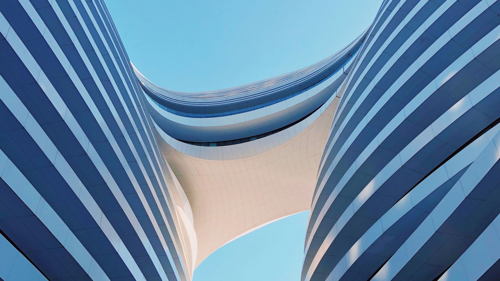 Dramatic modern commercial building facade, representative of premium commercial real estate